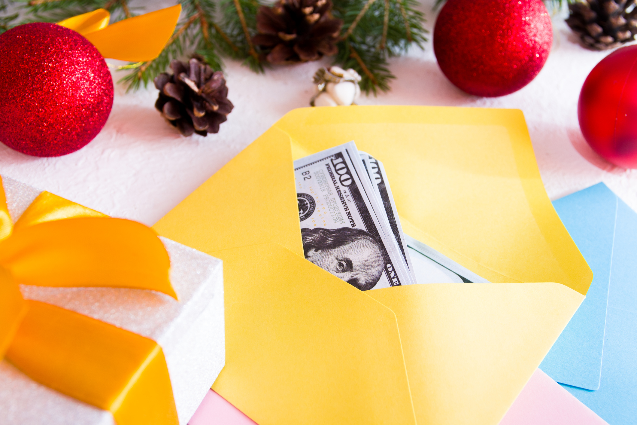 dollars in a yellow carpet on a background of Christmas decor, white background dollars in a yellow carpet on a background of Christmas decor, white background